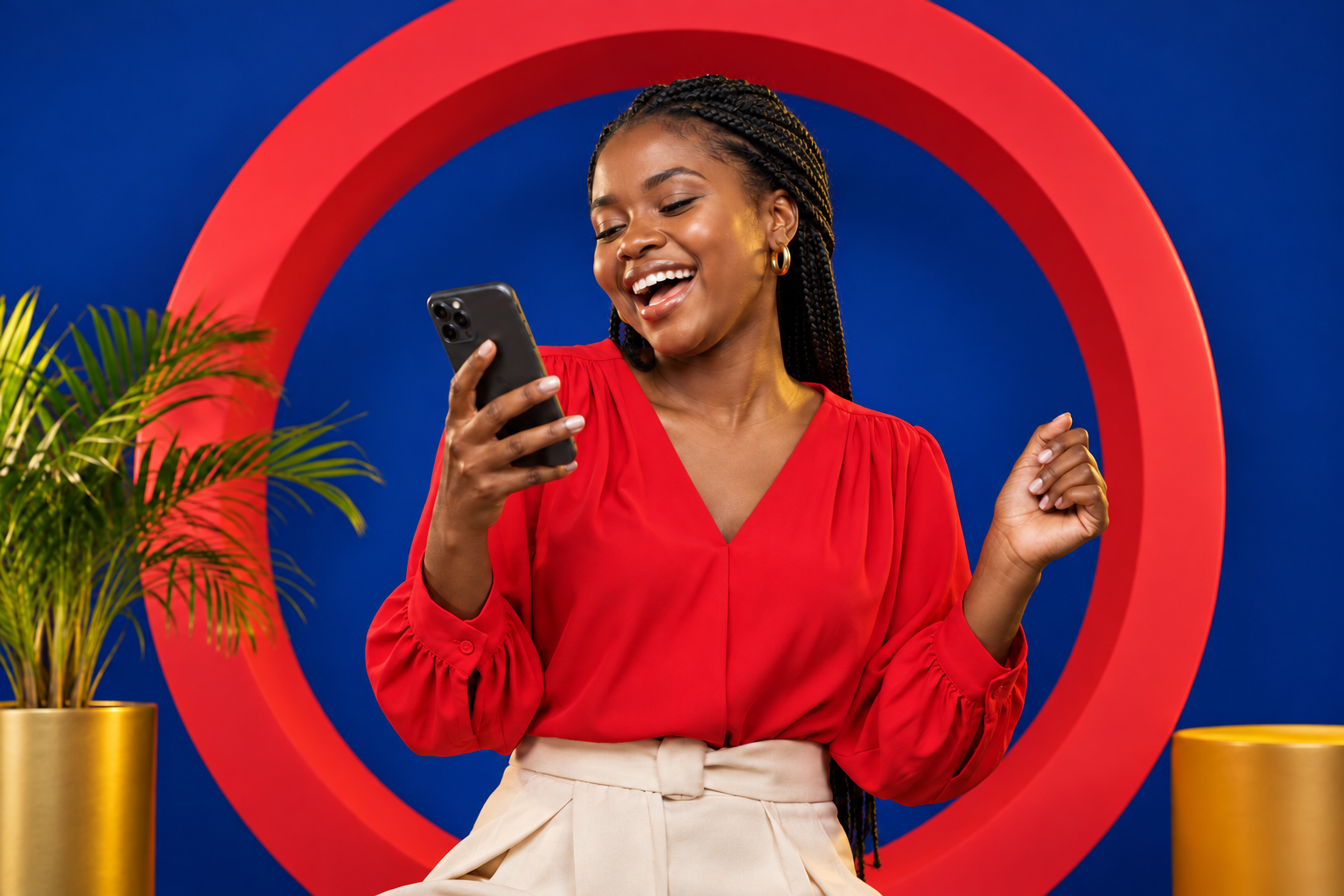 A woman smiling while reading a message on her phone